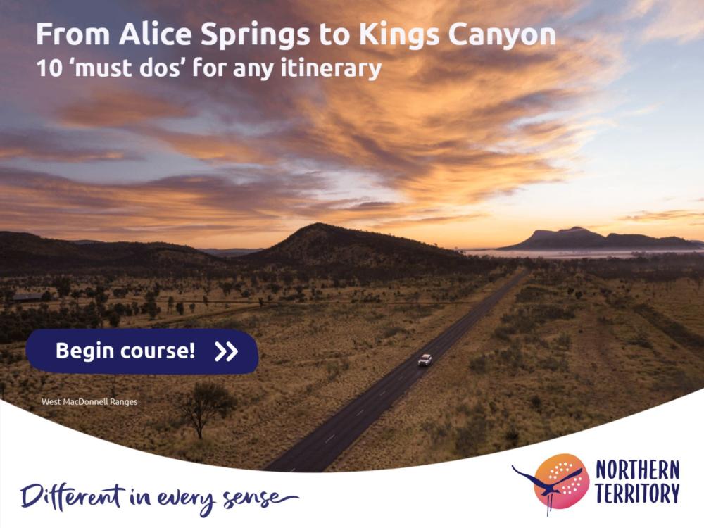 Aerial photo of a car driving in the beautiful Northern Territory outback near Alice Springs